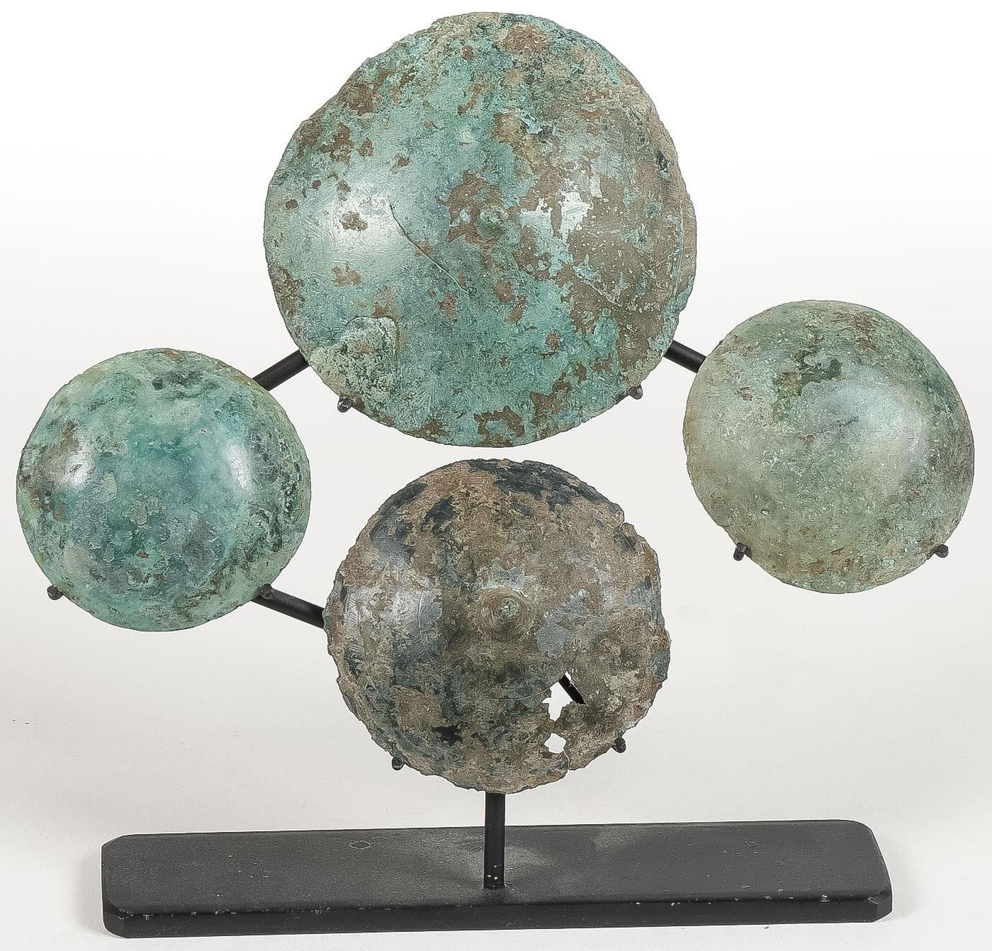 Group of Four Ancient Greek Bronze Shield Appliqués – Classical Period, 5th–4th Century BCE